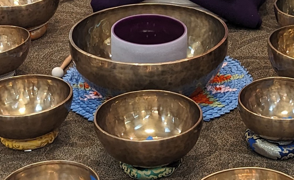 Sound bath meditation with traditional hand made Himalayan bowls at Ananda Temple campus in Bothell, WA